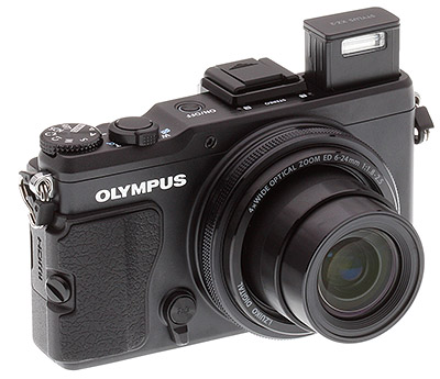 Olympus XZ-2 review: Three quarter view with flash