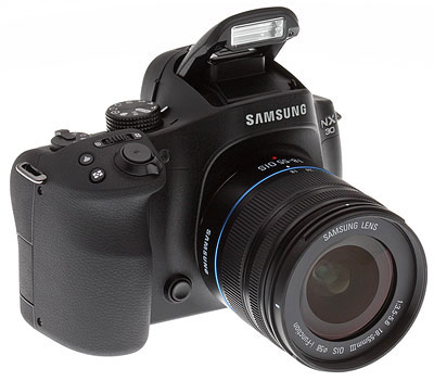 Samsung NX30 review -- three quarter from right view with flash extended