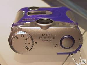 Konica's E-Mini-M digital camera, top view. Copyright (c) 2001, Michael R. Tomkins, all rights reserved. Click for a bigger picture!